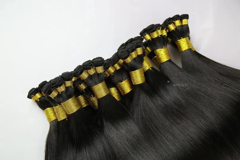 Hand tied Weft hair extensions black.